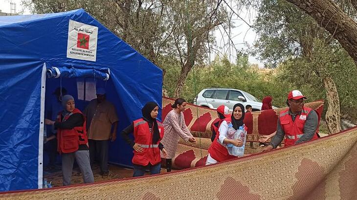Moroccan Red Crescent volunteers set up an assistance point to hand out water and other supplies following the September 8 earthquake.